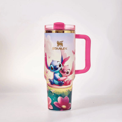 STANLEY Stitch and Angel tumbler gift set featuring pastel floral artwork, pink handle, matching gift box, butterfly accents, and insulated large-capacity design.