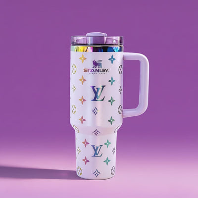 Stanley tumbler with colorful logo pattern on a purple background